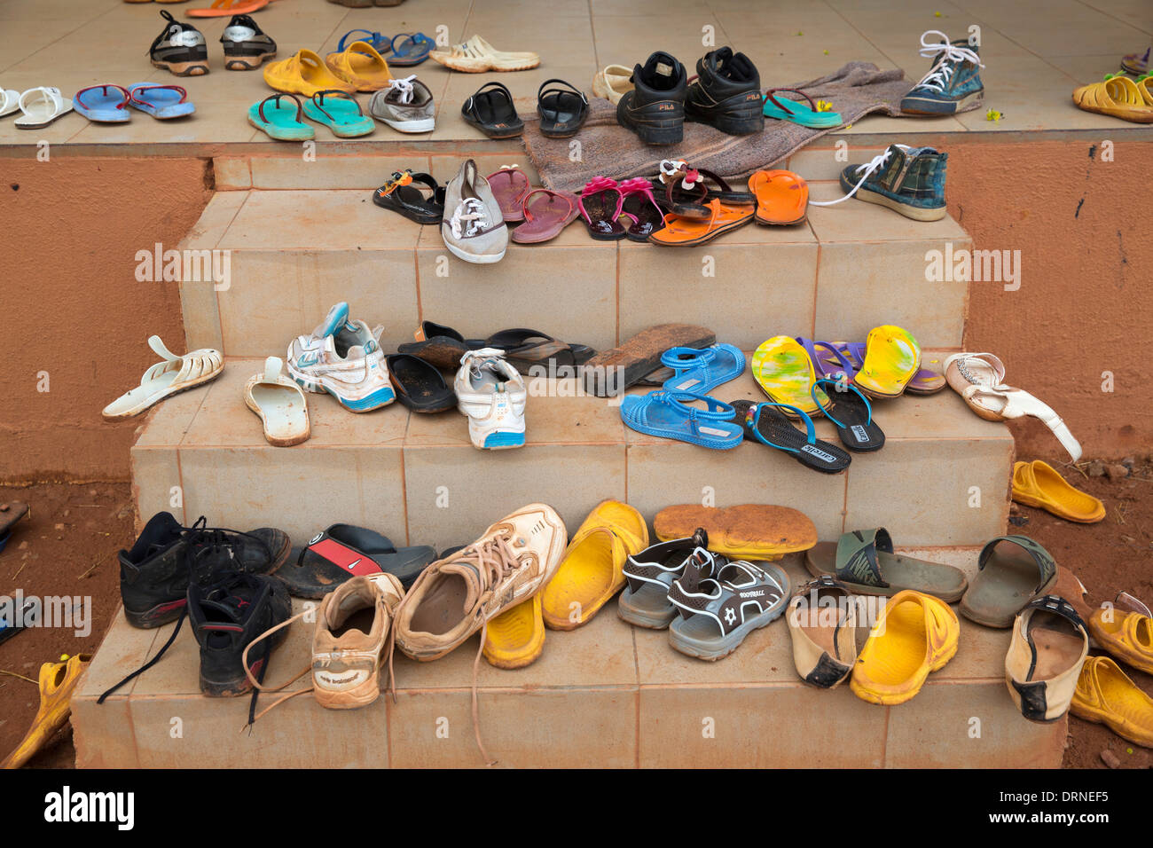 dusty shoes outside classroom of school in Bobo Dioulasso, Burkina Faso, Africa Stock Photo