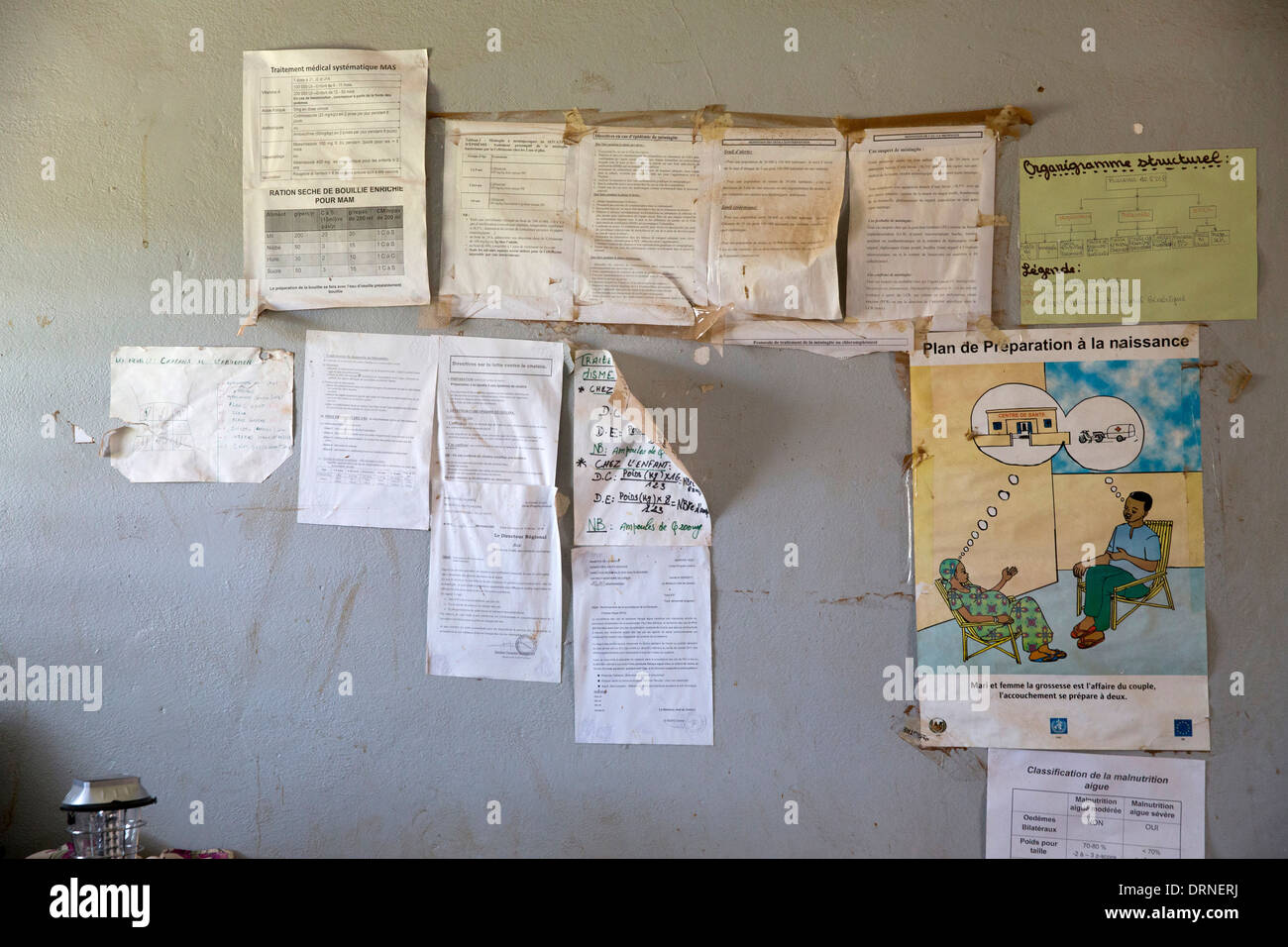 information posters on wall of rural medical centre, Burkina Faso, Africa Stock Photo