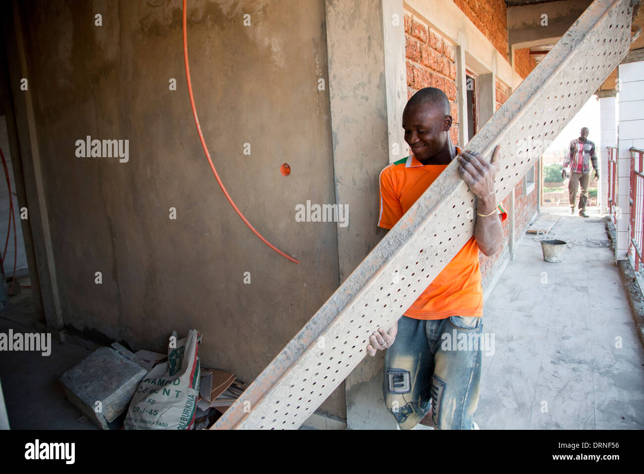 man building new healthcare centre in Burkina Faso, Africa Stock Photo