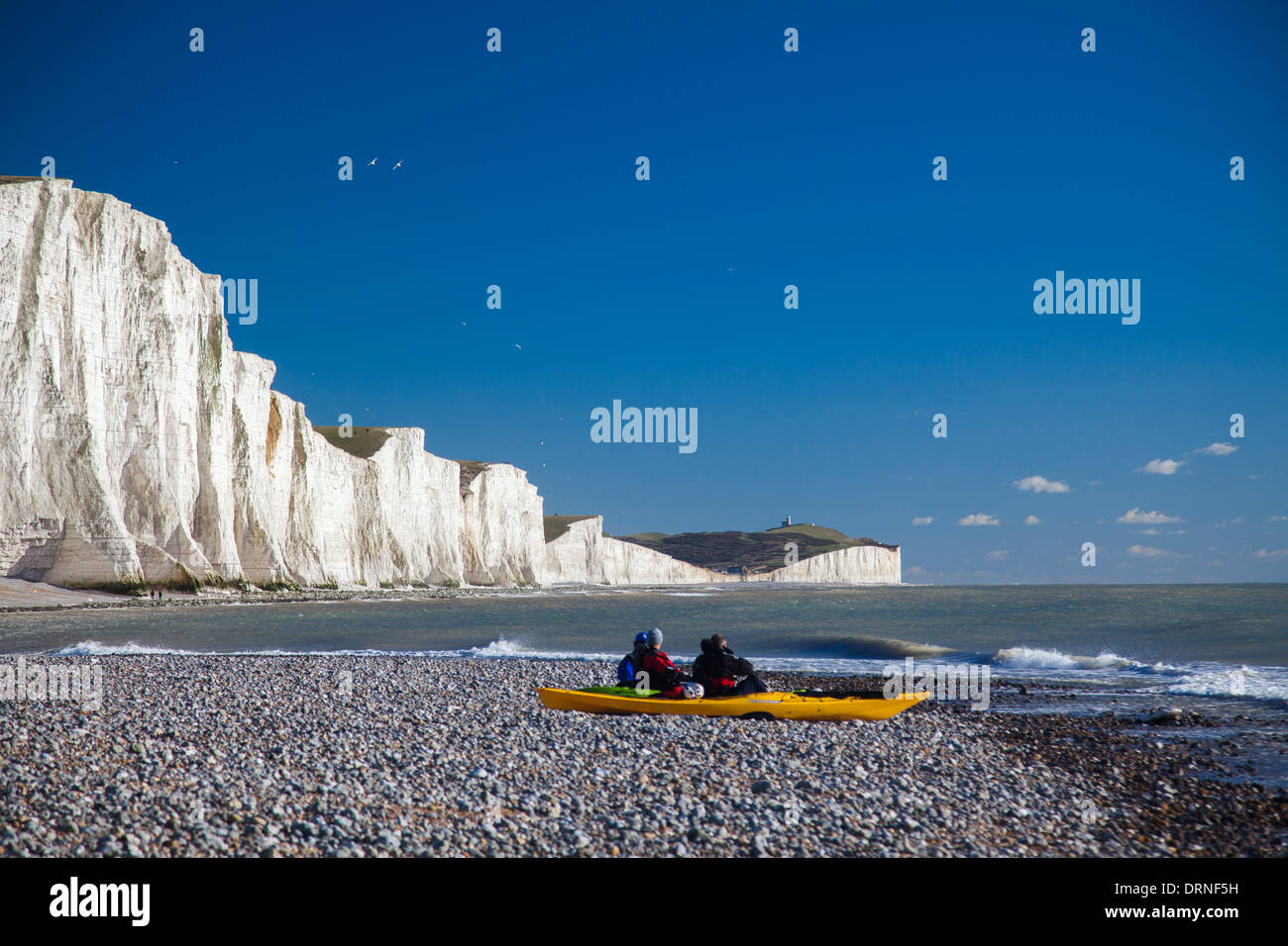 Kayakers at the Seven Sisters, Cuckmere Haven beach, County Sussex, England. Stock Photo