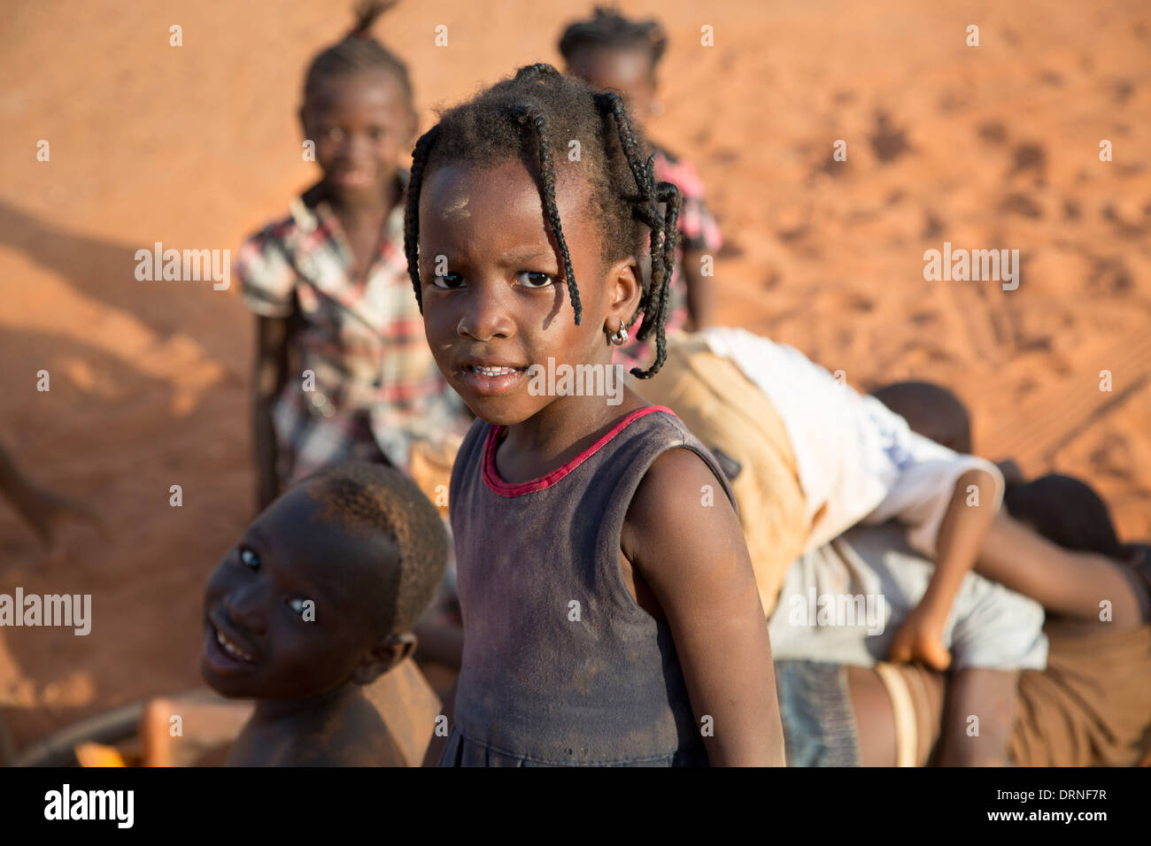 young girl smiling at camera in Bobo Dioulasso, Burkina Faso Stock Photo