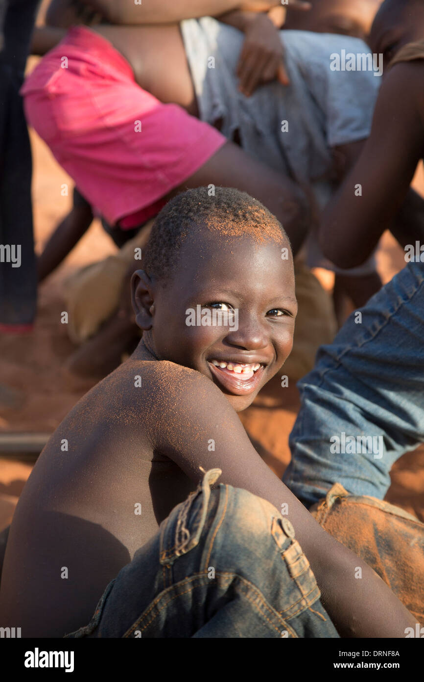 young boy smiling at camera in Bobo Dioulasso, Burkina Faso Stock Photo