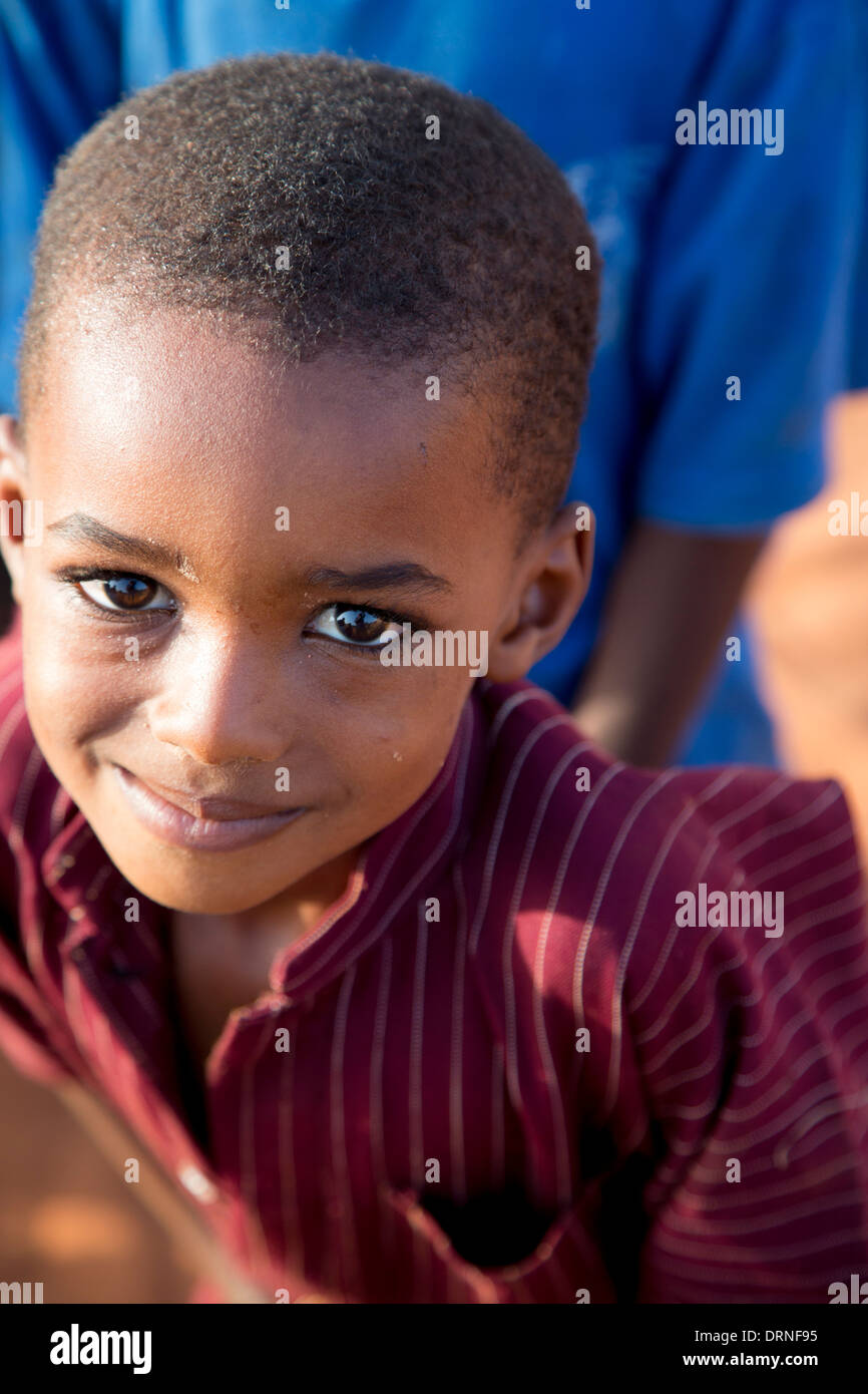 young boy smiling at camera in Bobo Dioulasso, Burkina Faso Stock Photo