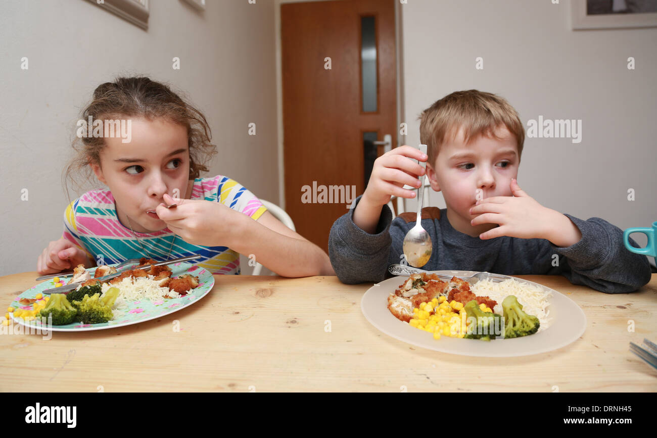 Children eating dinner Stock Photo Alamy