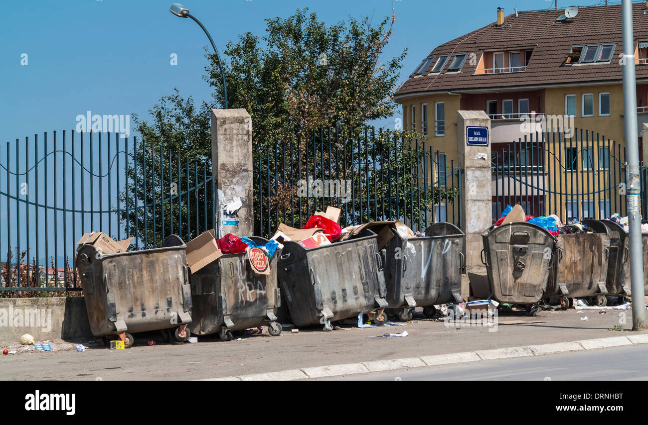 Rubbish bins lining a street, Europe Stock Photo