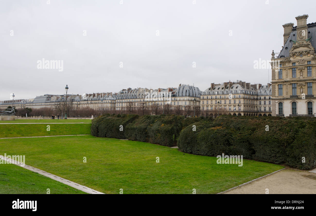 The Louvre Palace, former royal palace gardens and now museum and Rue de Rivoli in background, Paris, France. Stock Photo