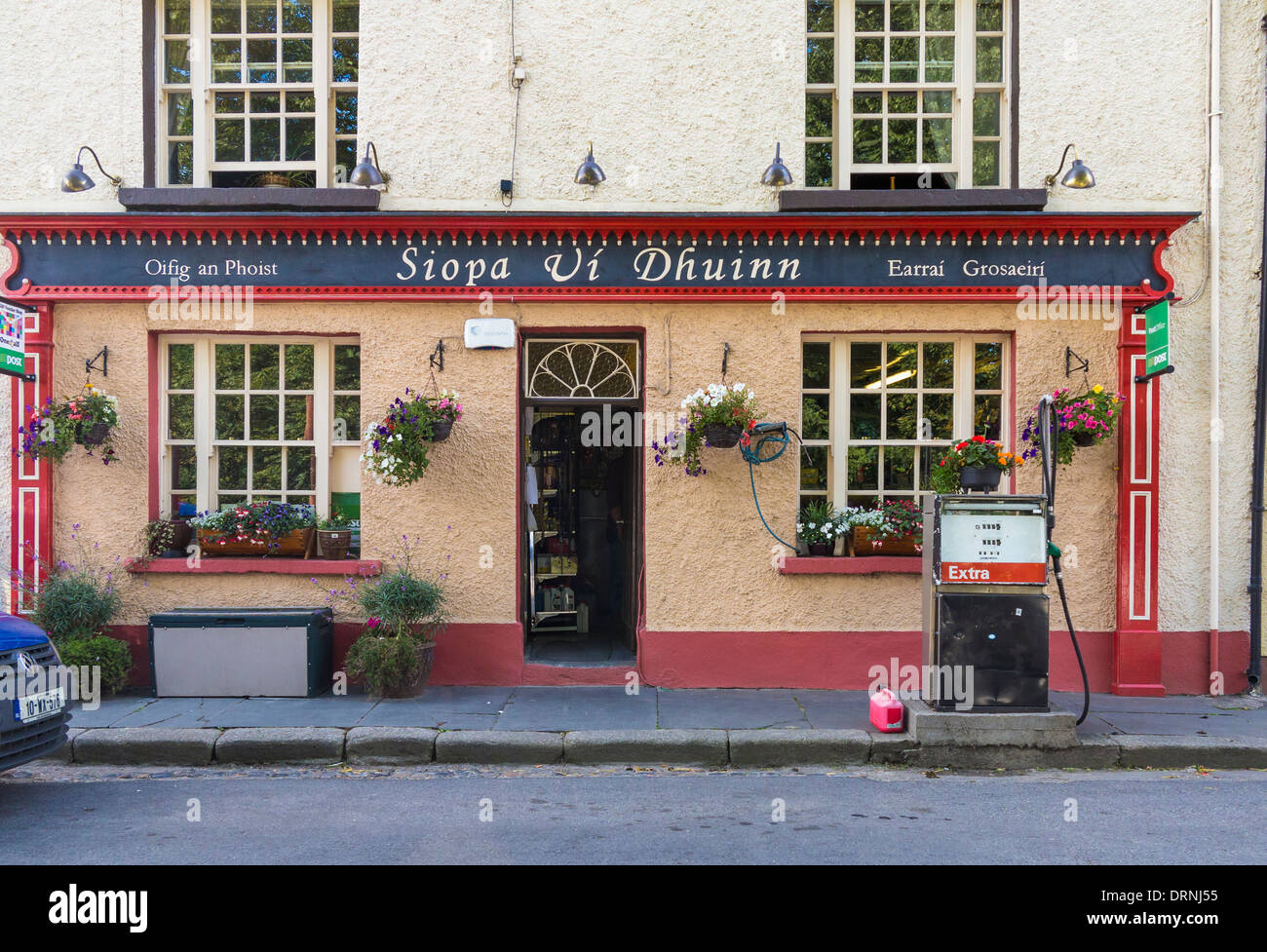 Ireland - Post Office shop and petrol pump in Clonegal, County Carlow, Republic of Ireland, Europe Stock Photo