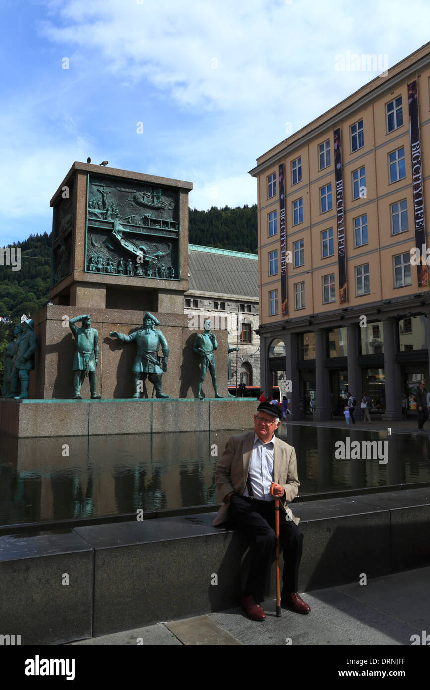 Man sitting at the Sjømannsmonumentet (sailors monument) in Bergen, Norway Stock Photo