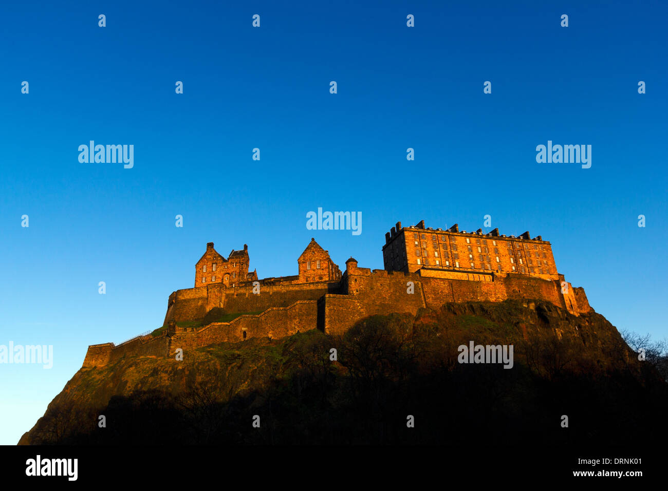 Edinburgh Castle, Scotland. Warm evening light with clear blue sky. Stock Photo