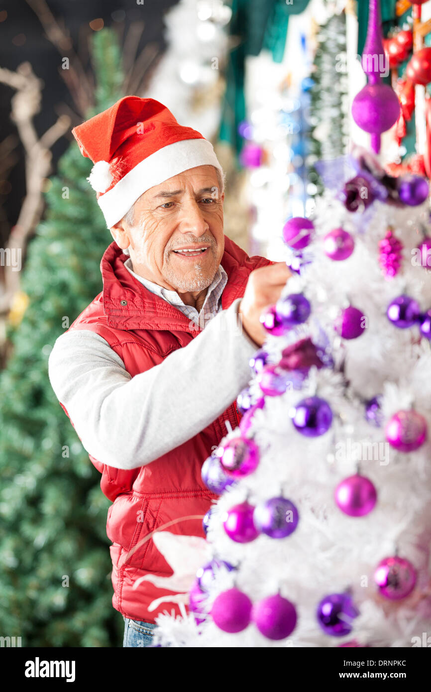 Owner Decorating Christmas Tree With Balls Stock Photo Alamy