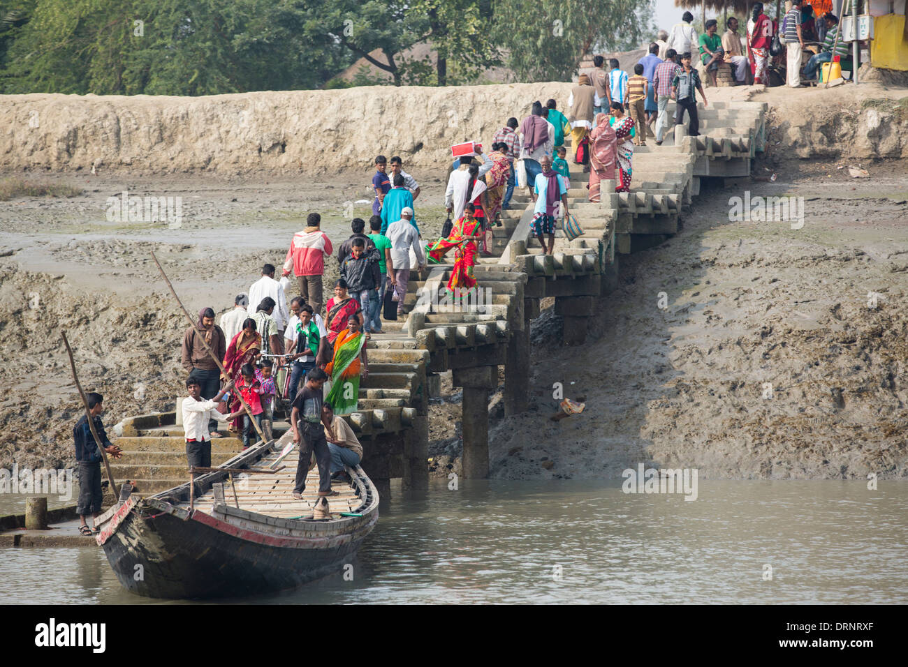 Boats carrying people and goods in the Sunderbans, a low lying area of the Ganges Delta in Eastern India, that is very vulnerable to sea level rise. Stock Photo