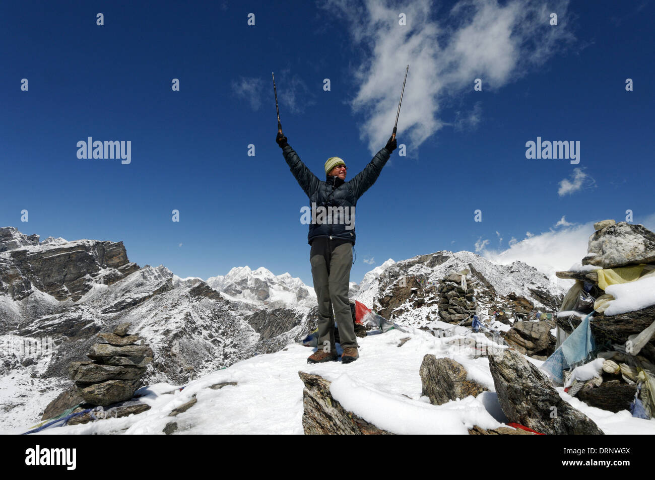 A lady trekker celebrates arriving at the summit of Gokyo Ri, Nepal himalaya Stock Photo