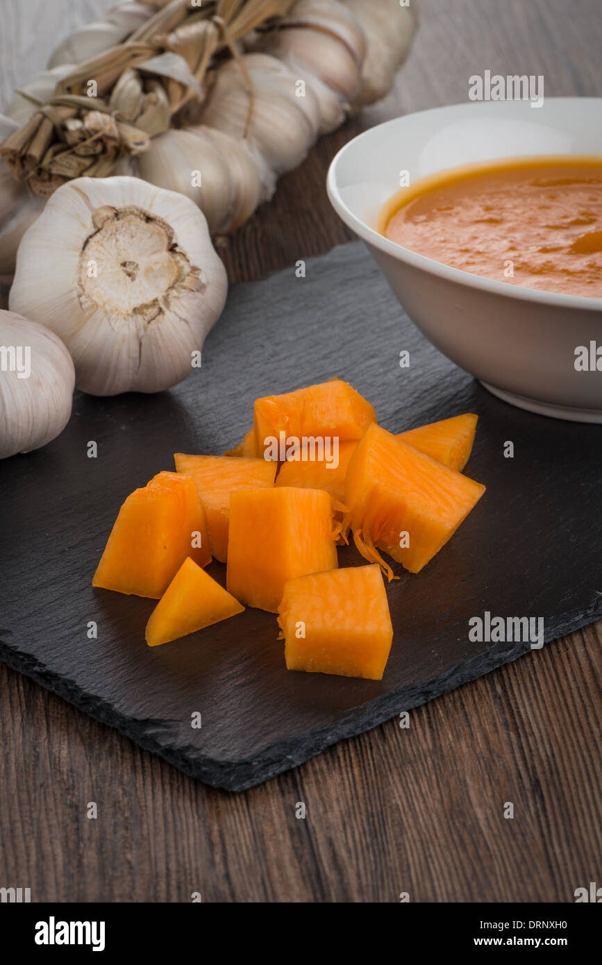 Pumpkin soup on white wood background Stock Photo - Alamy