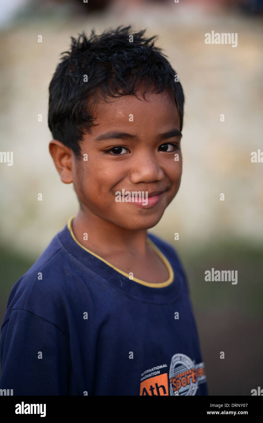 Portrait of smiling Indonesian boy looking at the camera. Sumba Island ...