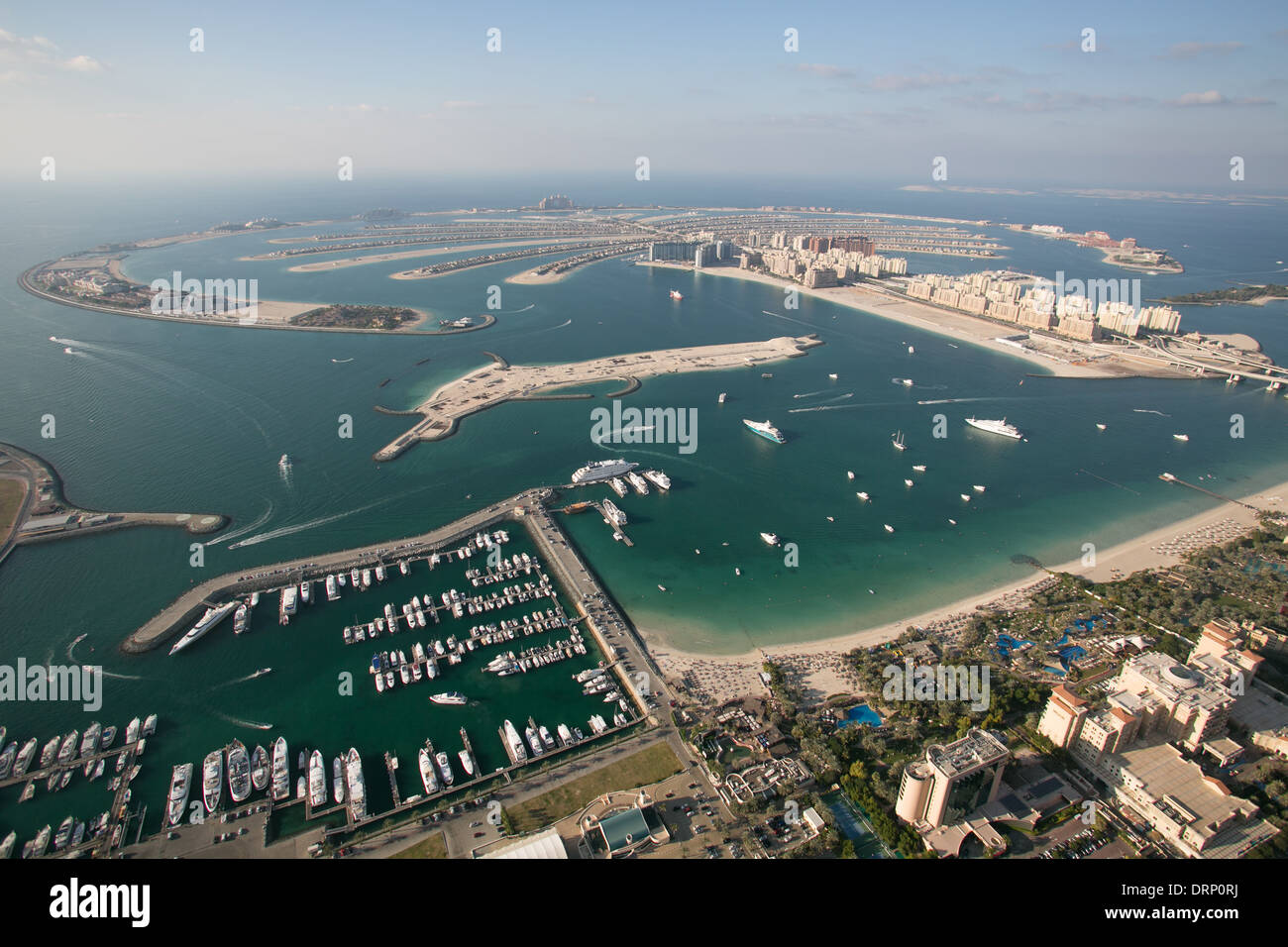 Aerial photo of Dubai in UAE showing Palm Jumeirah, Dubai International Marine Club and Stock Photo