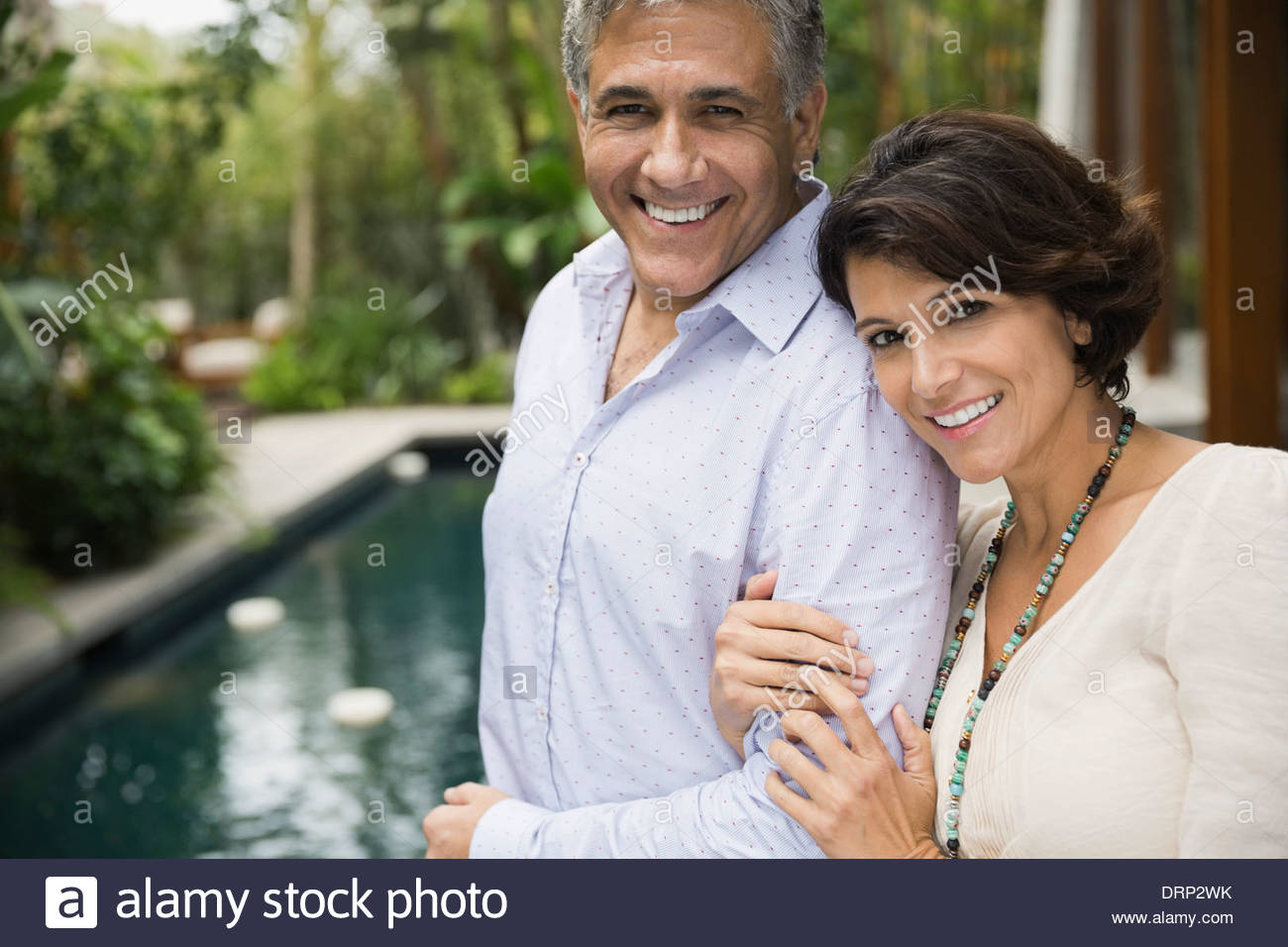 Portrait of mature couple standing outdoors Stock Photo