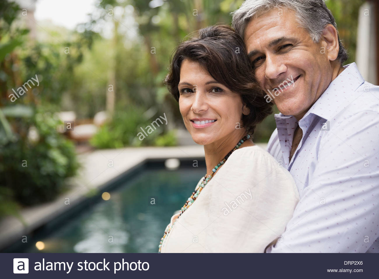 Portrait of mature couple standing outdoors Stock Photo