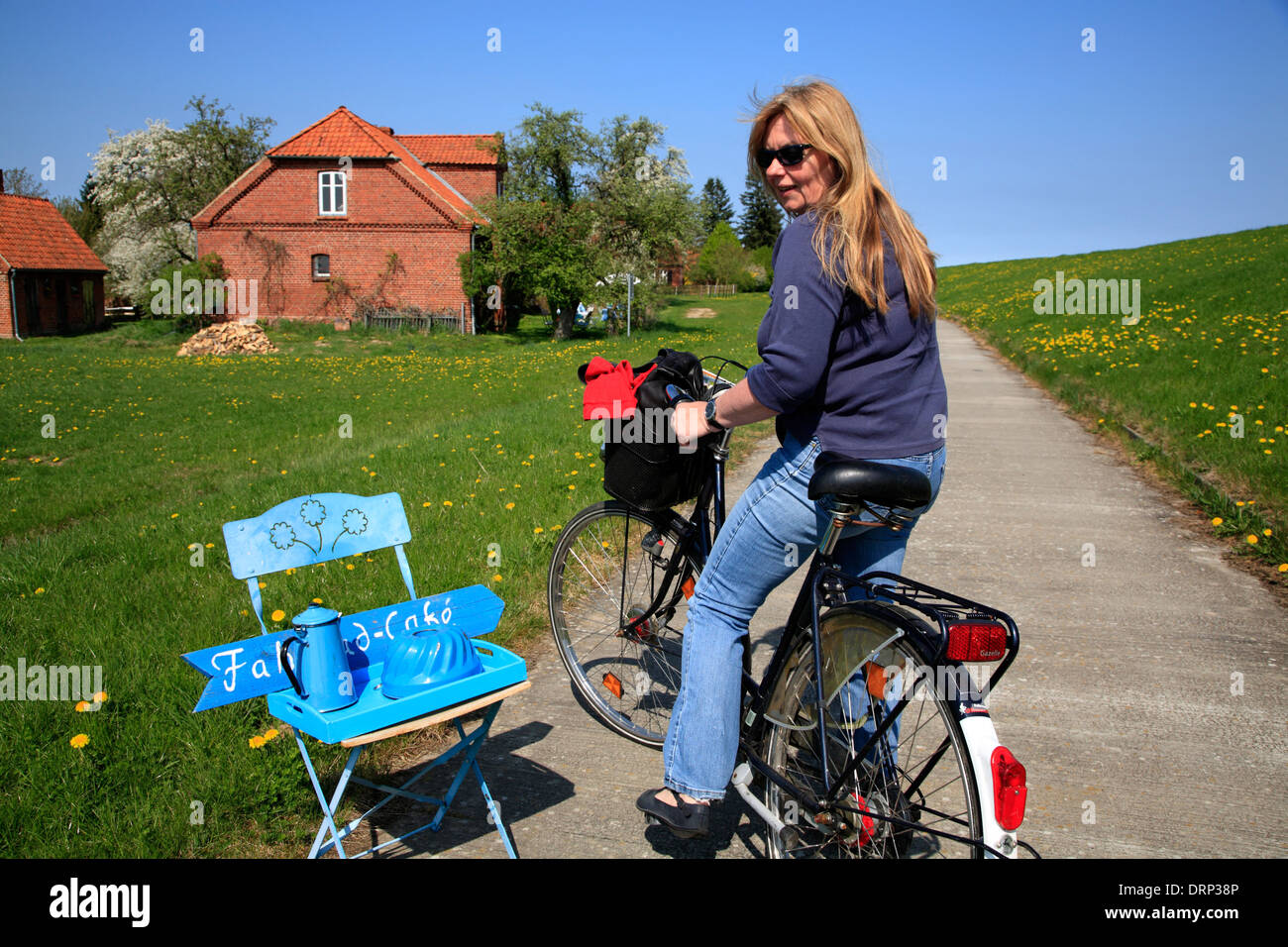 Cyclist at Sign for a Cycle Cafe at Wilkenstorf, Elbe Cycle Route, Amt Neuhaus, Lower Saxony, Germany, Europe Stock Photo