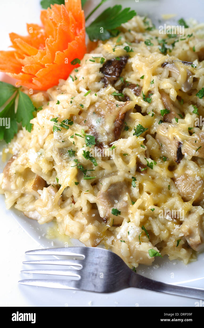 Rice with cheese, risotto con funghi Stock Photo