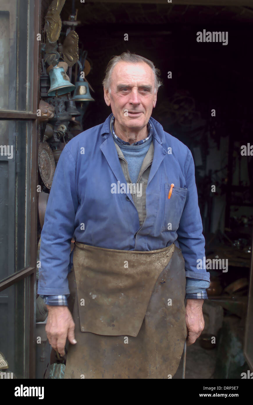 blacksmith standing in front of his shop in Abruzzo Italy Stock Photo