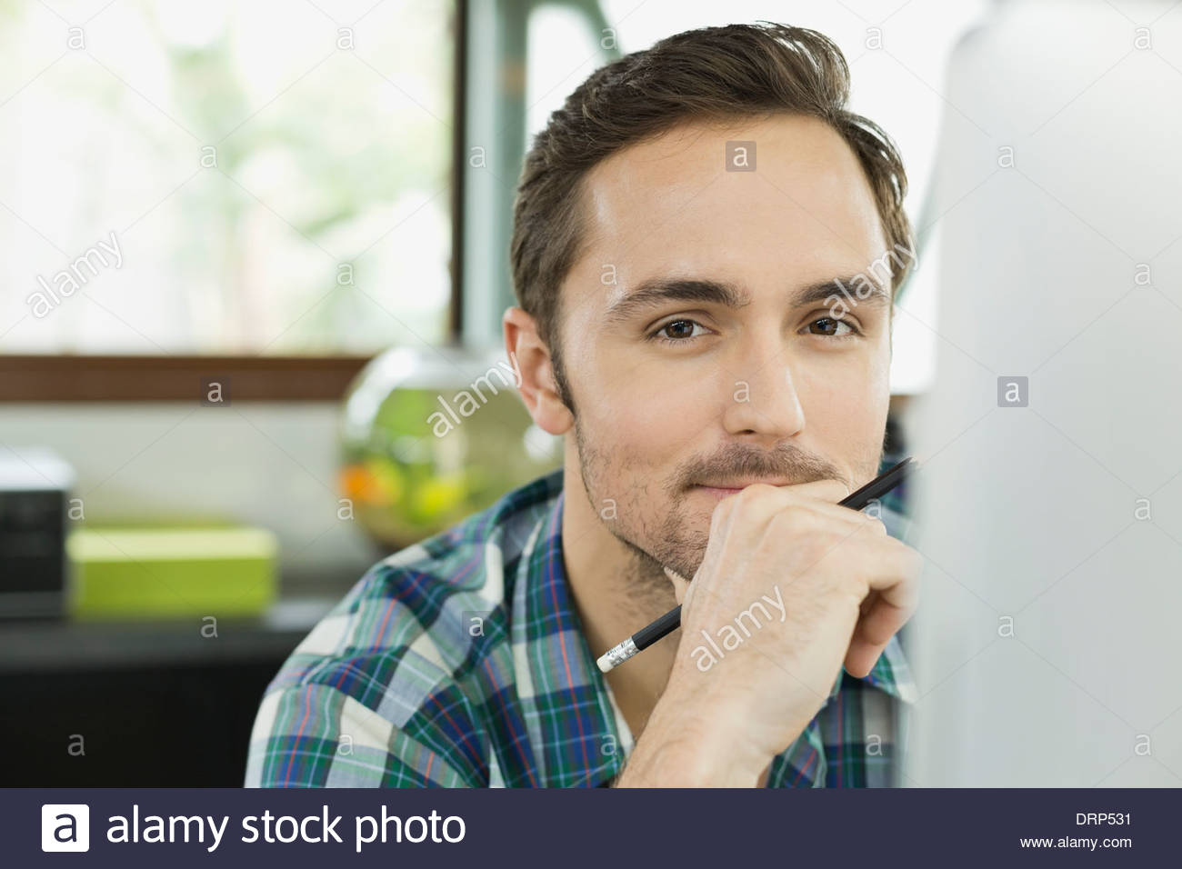 Portrait of young working professional in home office Stock Photo