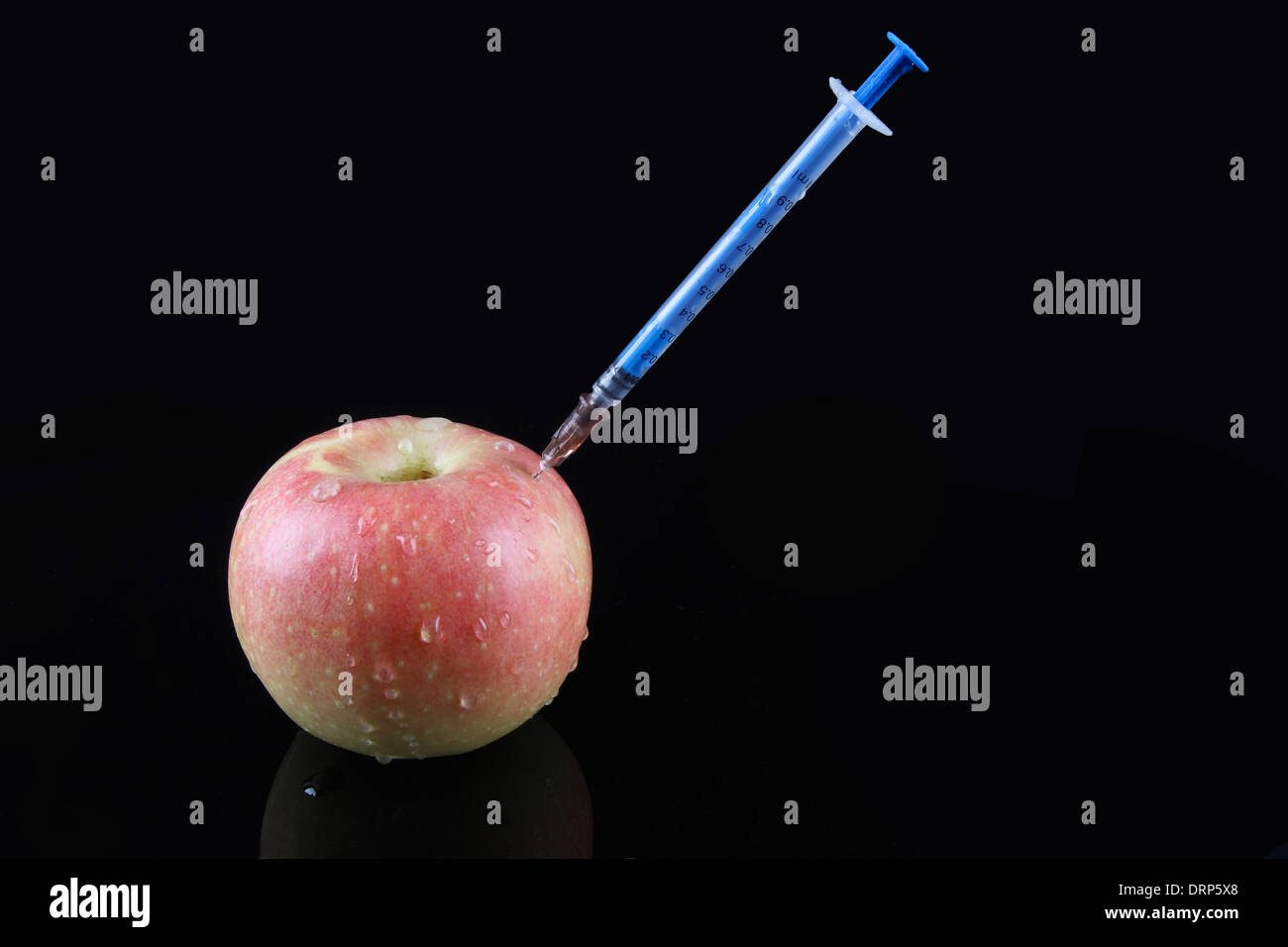 syringe and apple Stock Photo