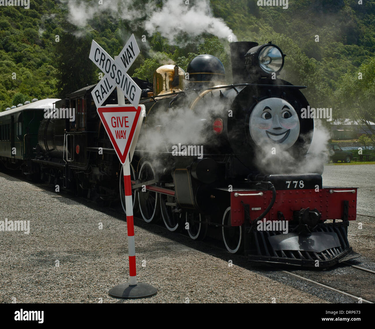 Kingston Flyer - a preserved steam locomotive in New Zealand about to start  journey with a Thomas the Tank Engine face on it Stock Photo