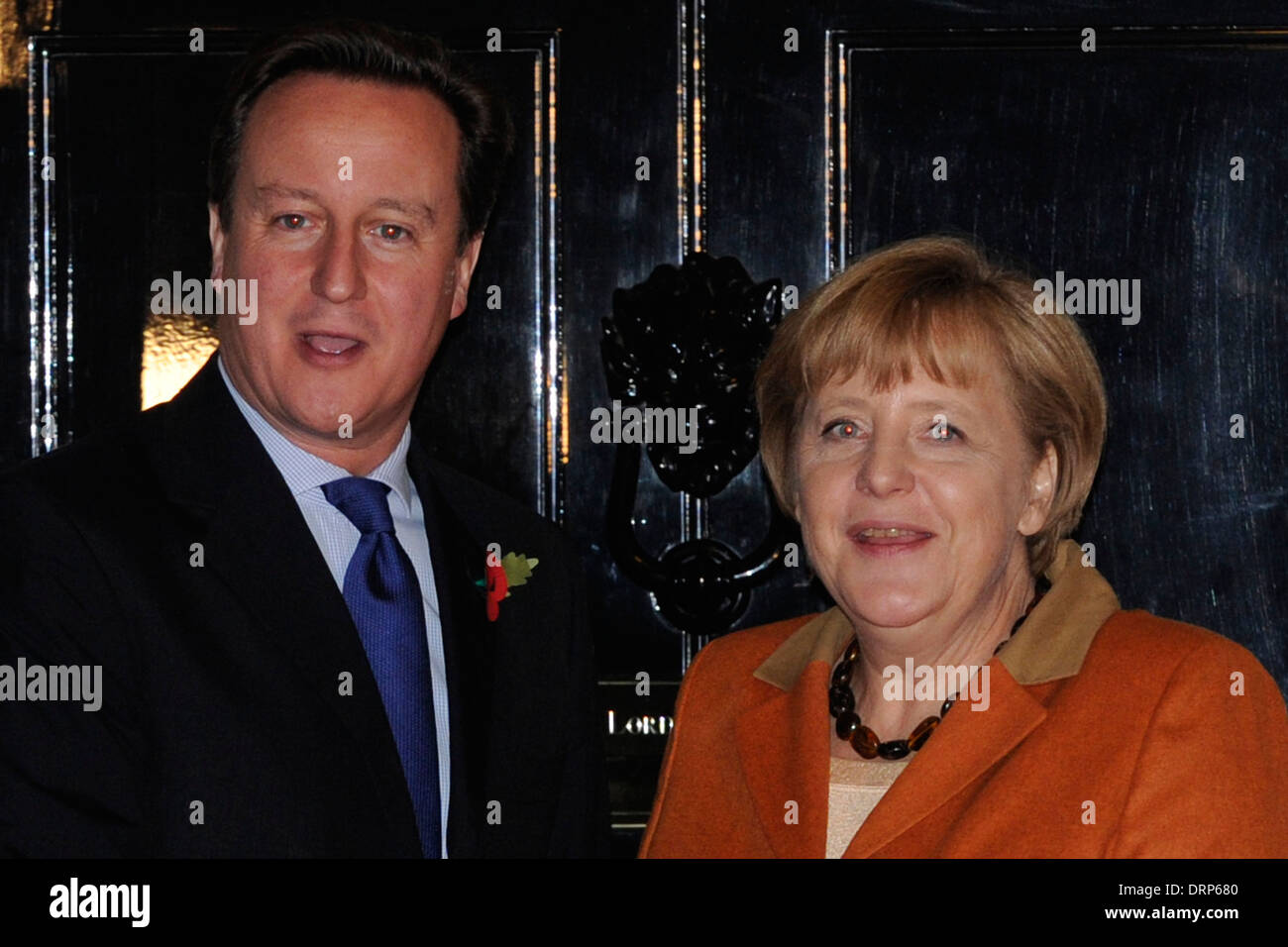 British Prime Minister David Cameron (L) greets German Chancellor Angela Merkel Stock Photo