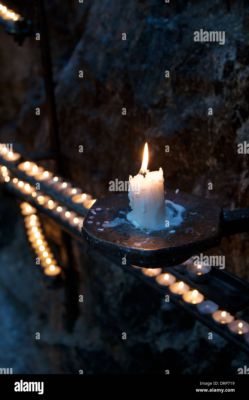 Candle burns and drips wax Stock Photo Alamy