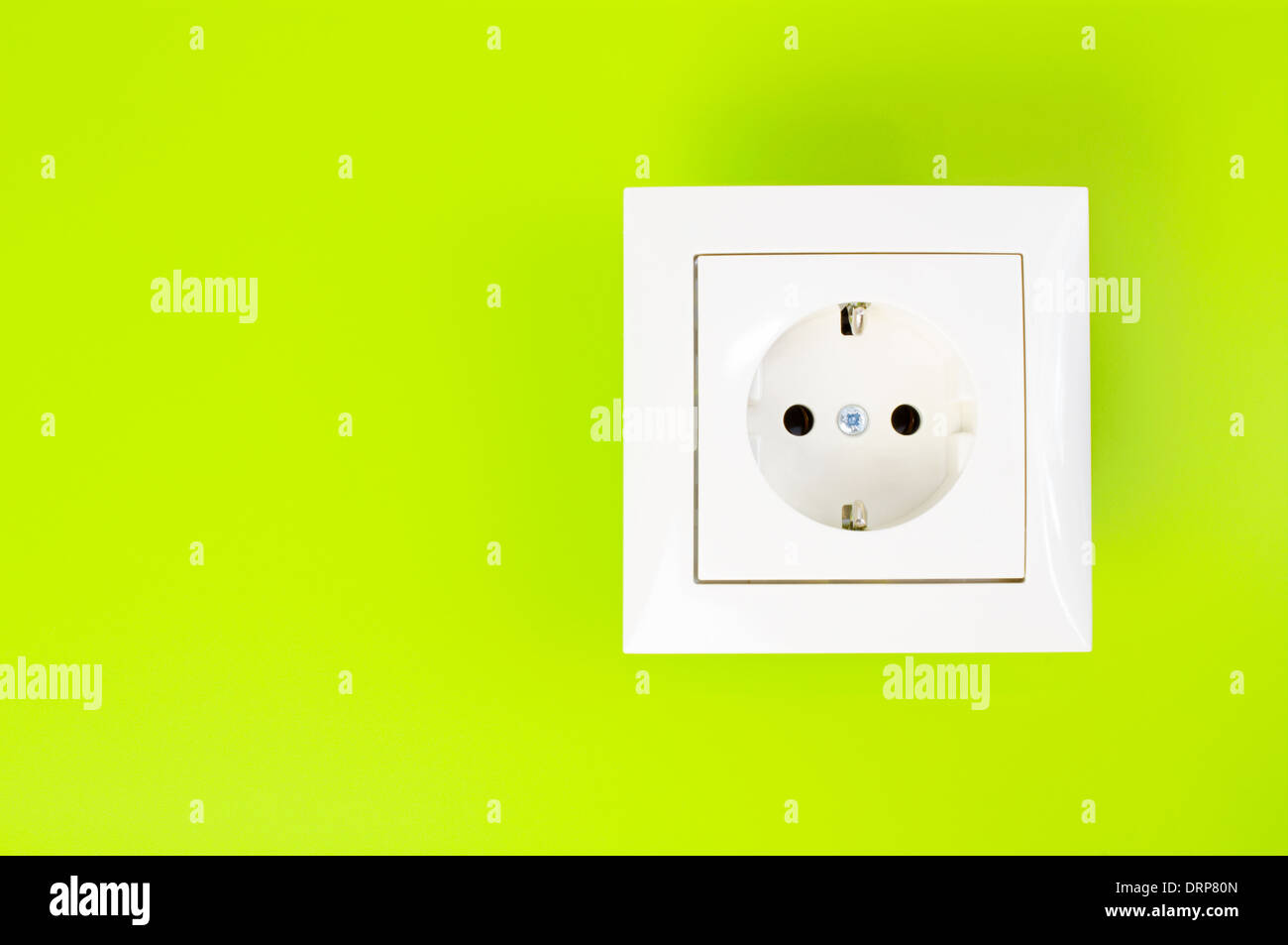 White European power socket on green background Stock Photo