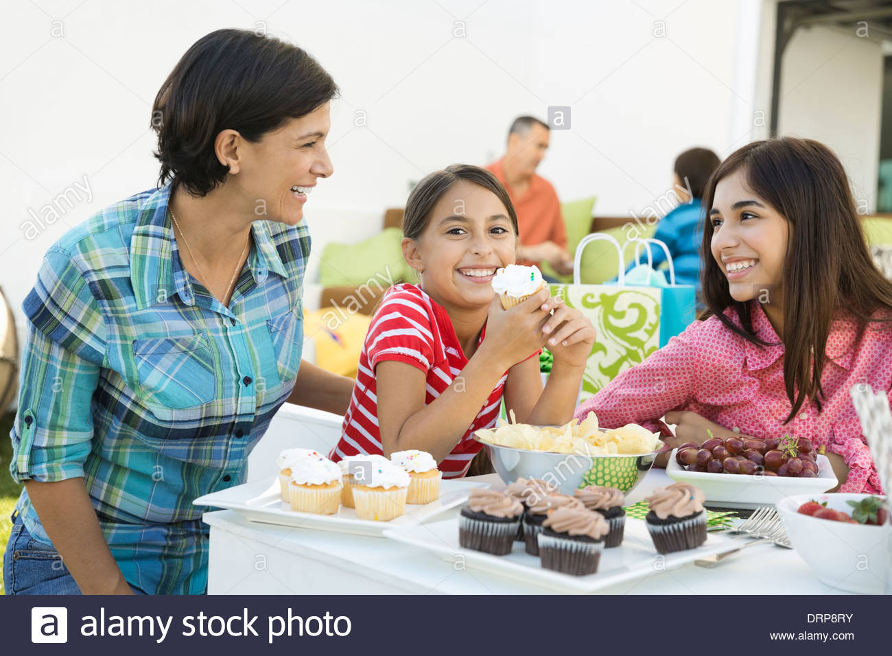 Portrait of girl enjoying birthday party with family Stock Photo