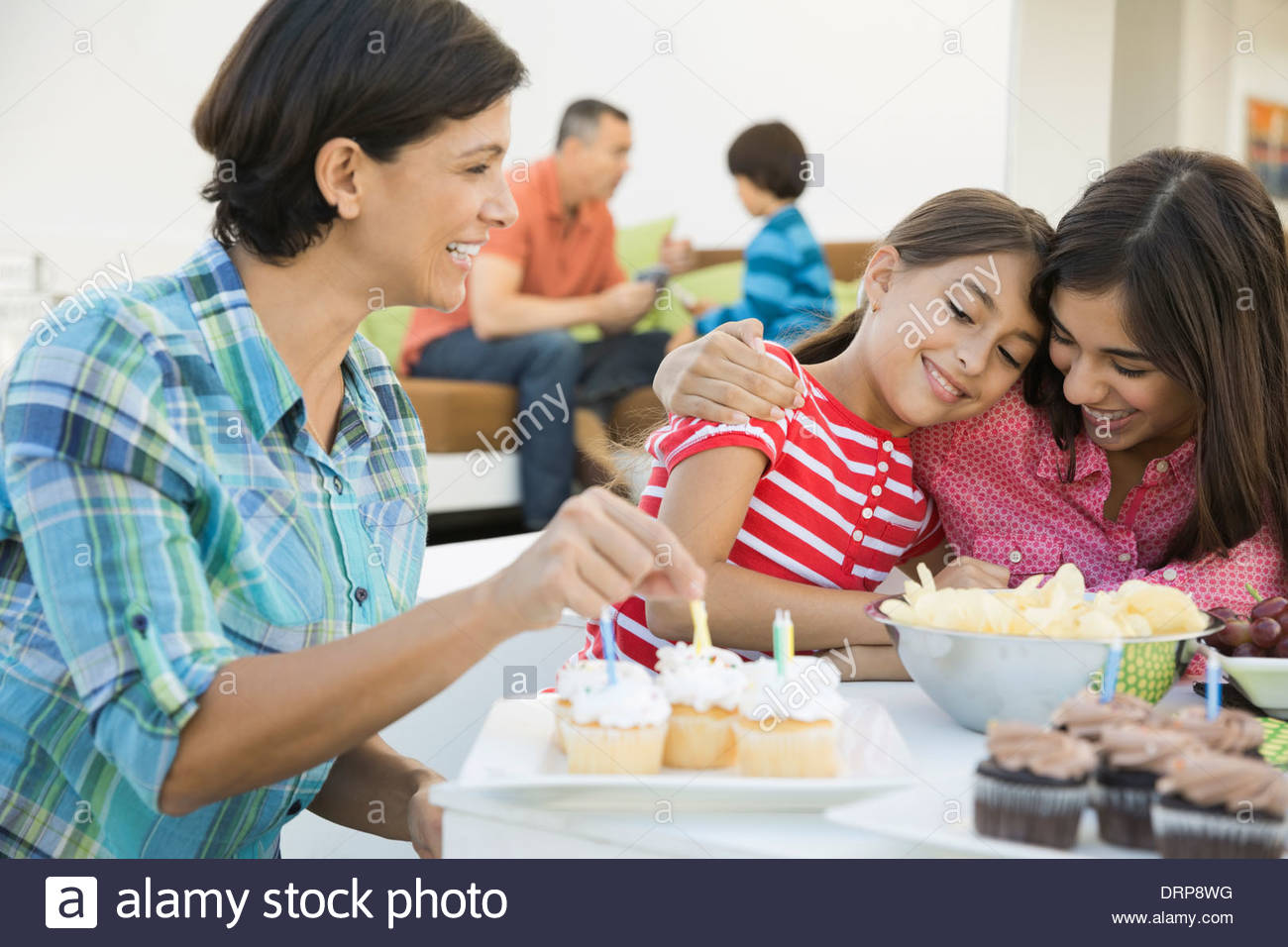 Family celebrating girls birthday Stock Photo