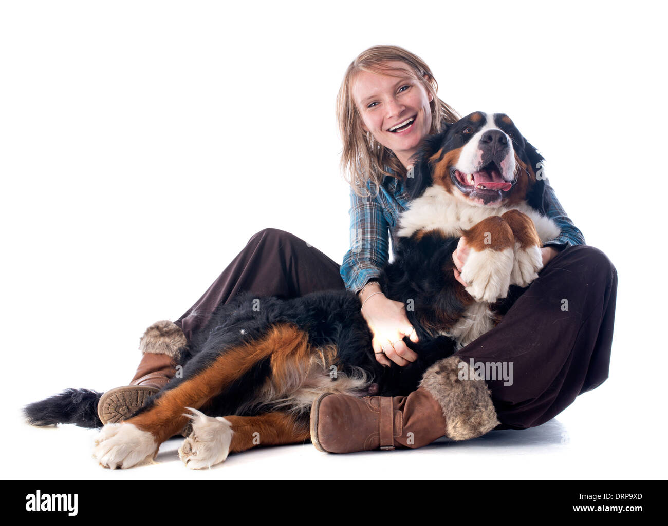 woman and her bernese mountain dog in front of white background Stock Photo