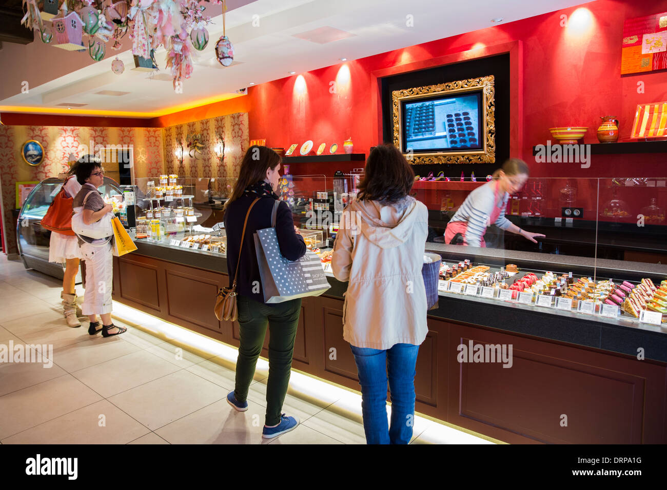 Shoppers in Patisserie and Chocolatier shop Carbillet in Rue des Forges in Dijon in the Burgundy region of France Stock Photo