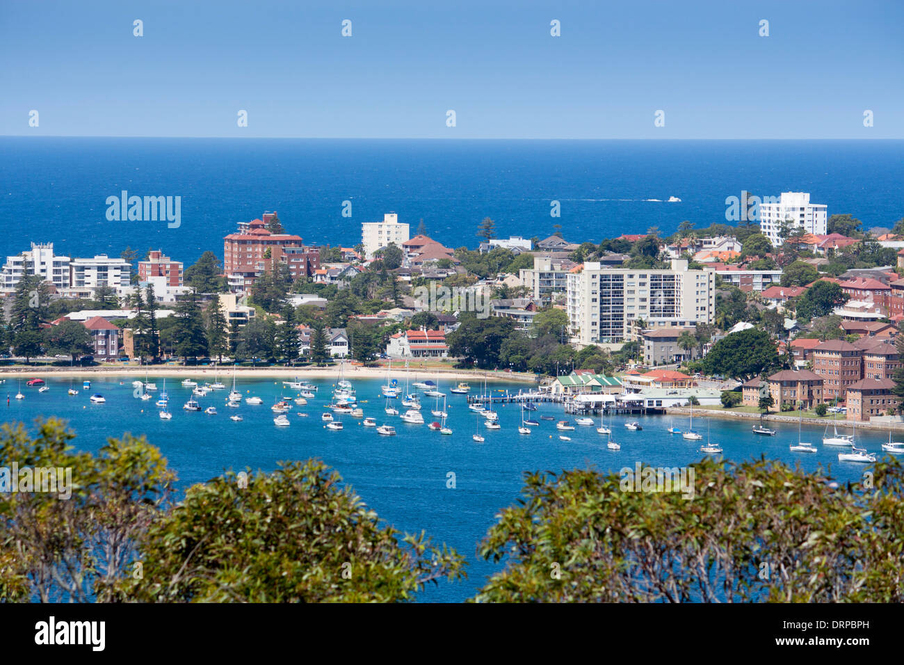 View of Manly Cove from Dobroyd Head with boats in harbour and Pacific Ocean beyond Sydney New South Wales Australia Stock Photo