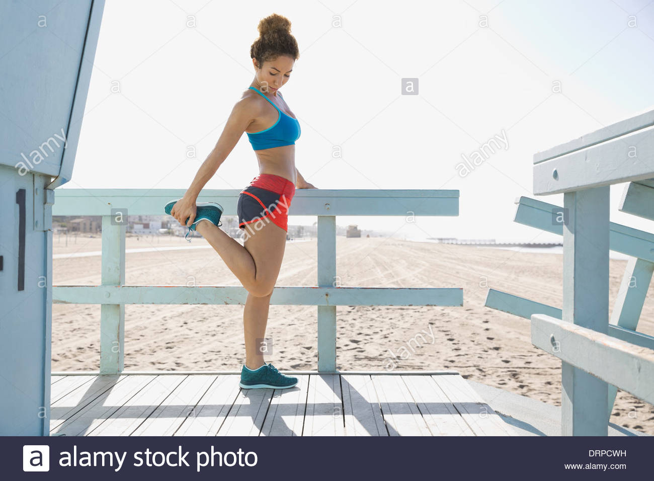 Woman stretching quads Stock Photo