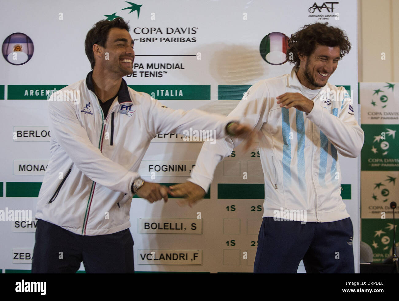 Mar Del Plata, Argentina. 30th Jan, 2014. Argentina's Davis Cup single player, Juan Monaco (R) and Fabio Fognini (L) of Italy, joke while posing at the end of drawing for the game matches of the first round of the Davis Cup World Group 2014 between Argentina and Italy, in Mar del Plata, 404 km from Buenos Aires, capital of Argentina, on Jan. 30, 2014. Argentina and Italy will face each other in the first round of the Davis Cup World Group at Patinodromo Municipal Adalberto Lugea in Mar del Plata, from Jan. 31 to Feb. 2. Credit:  Martin Zabala/Xinhua/Alamy Live News Stock Photo
