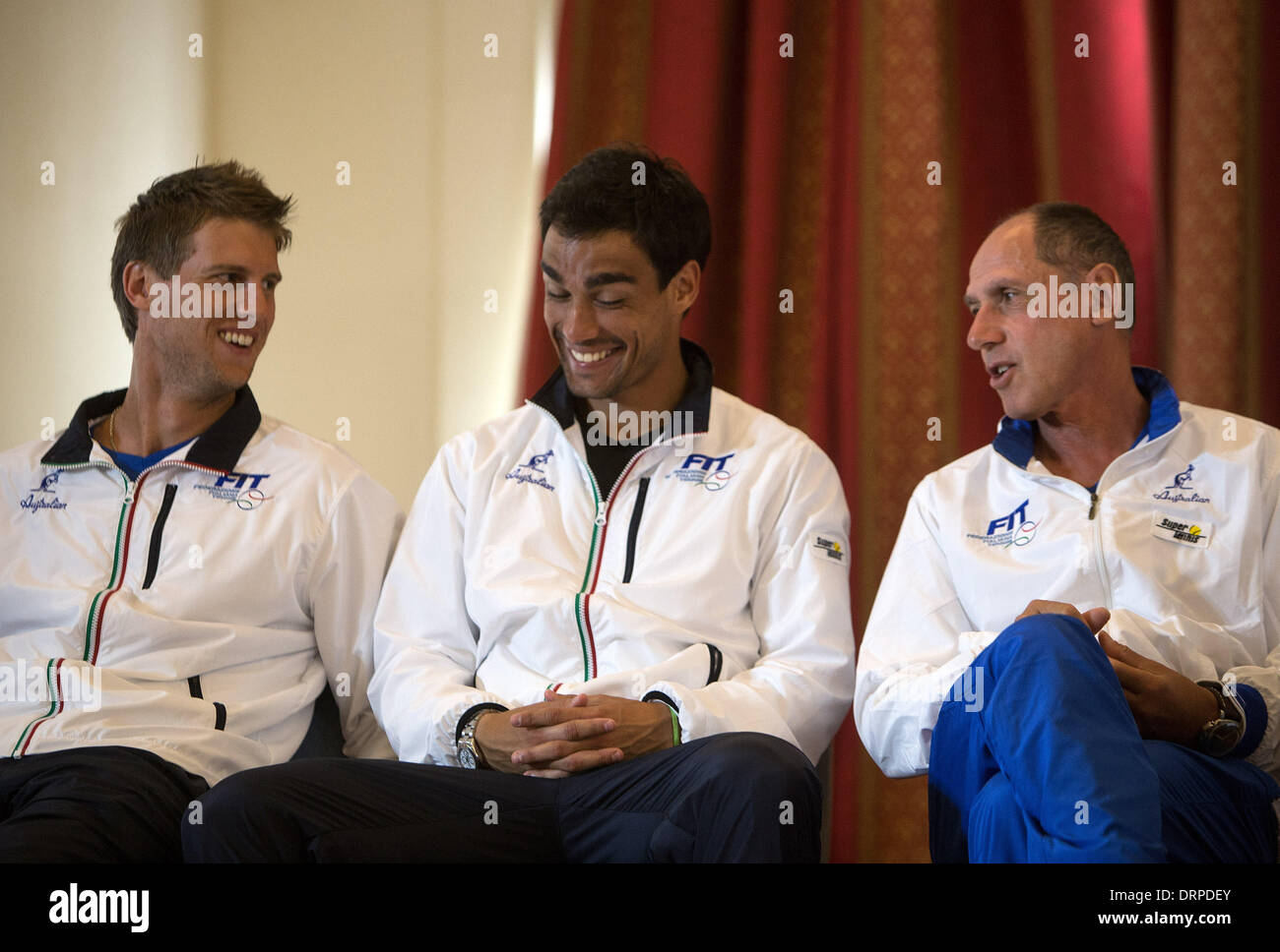 Mar Del Plata, Argentina. 30th Jan, 2014. Captain of Italy's Davis Cup team, Corrado Barazzutti (R), reacts along with players Fabio Fognini (C) and Andreas Seppi (L), during the drawing for the game matches of the first round of the Davis Cup World Group 2014 between Argentina and Italy, in Mar del Plata, 404 km from Buenos Aires, capital of Argentina, on Jan. 30, 2014. Argentina and Italy will face each other in the first round of the Davis Cup World Group at Patinodromo Municipal Adalberto Lugea in Mar del Plata, from Jan. 31 to Feb. 2. Credit:  Martin Zabala/Xinhua/Alamy Live News Stock Photo