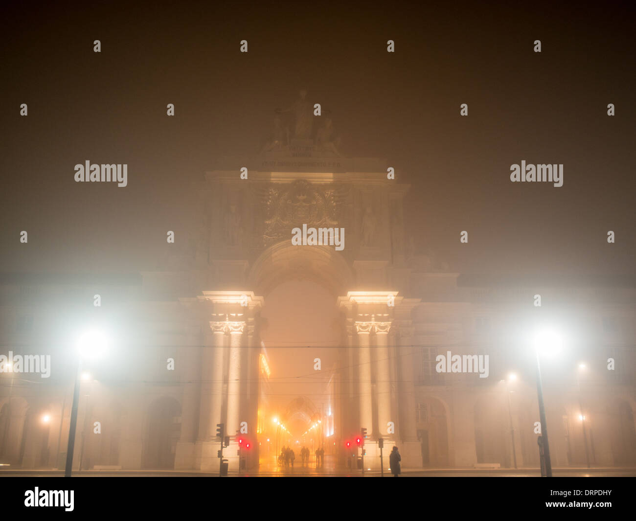 The Arch of Augusta street hiddes behinde the fog at night Stock Photo