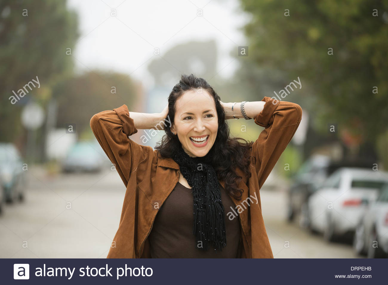 Woman standing outdoors hi-res stock photography and images - Alamy
