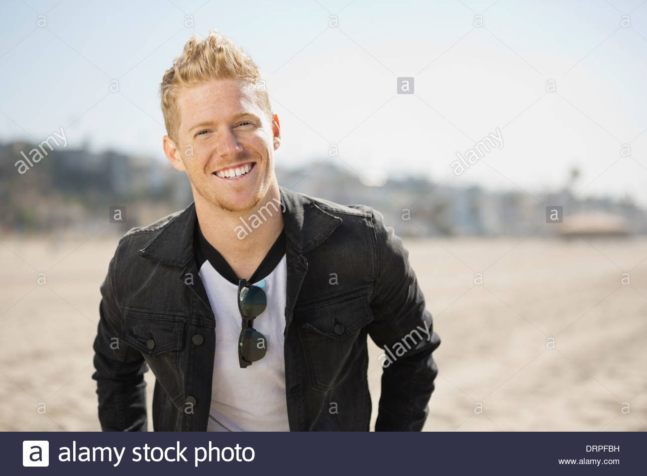 Portrait of fashionable man on beach Stock Photo