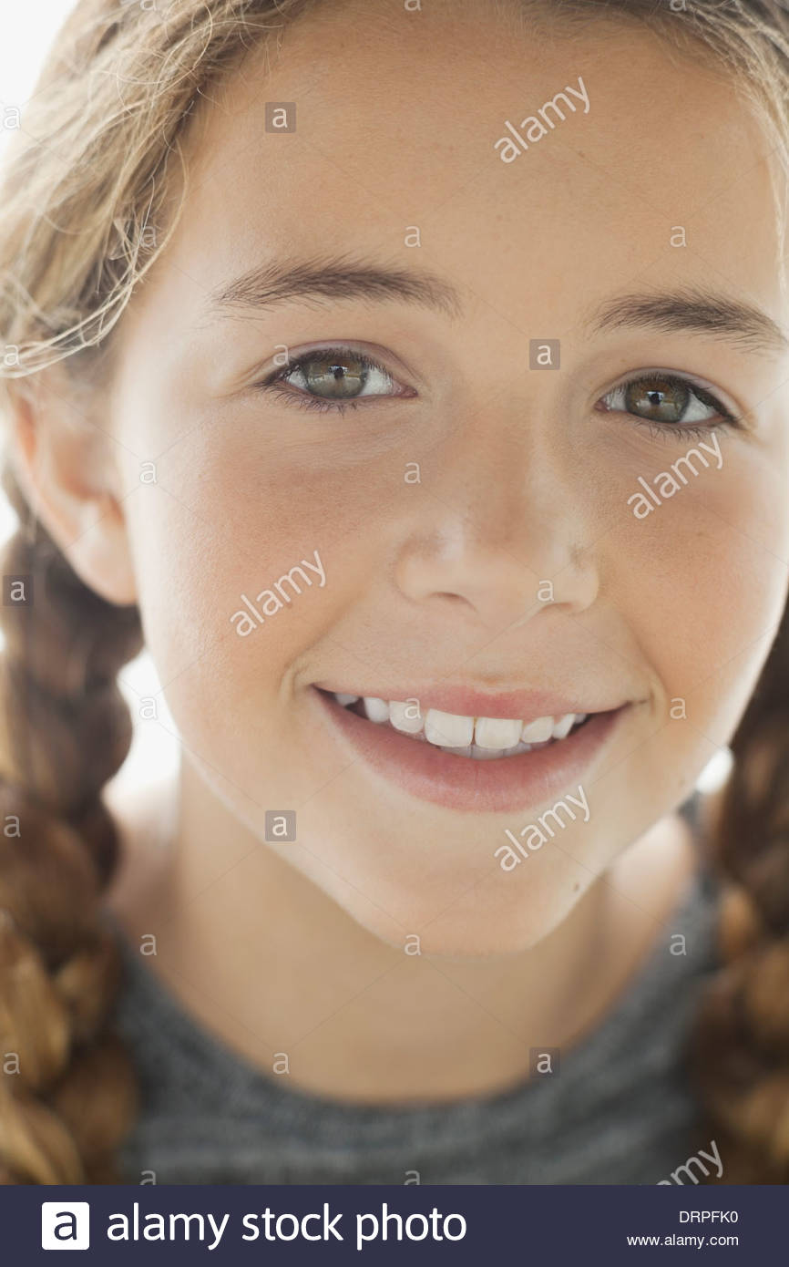 Close-up portrait of smiling girl Stock Photo