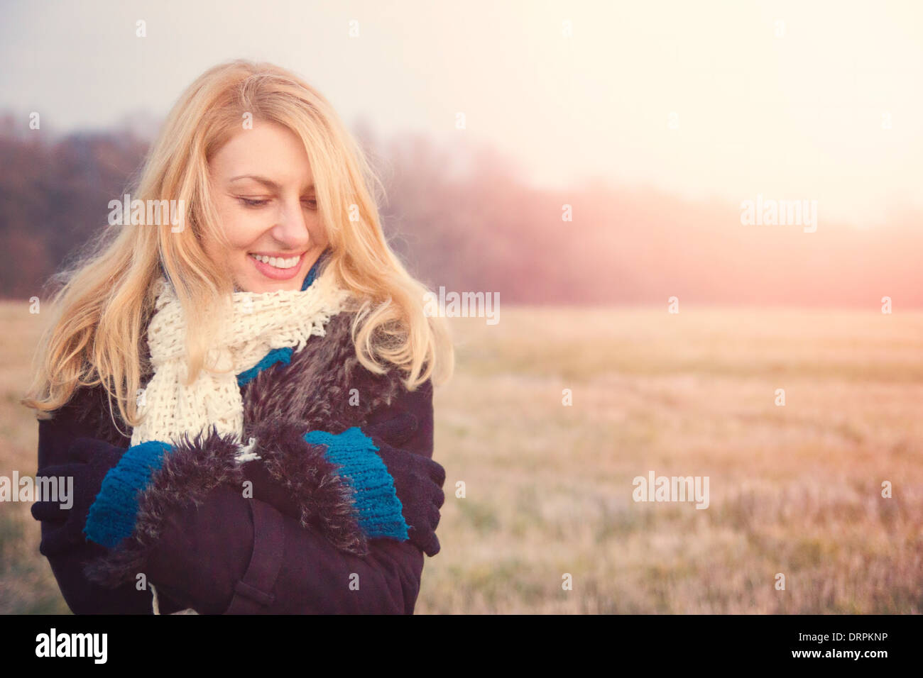 beautiful smiling girl in nature field near forest Stock Photo - Alamy