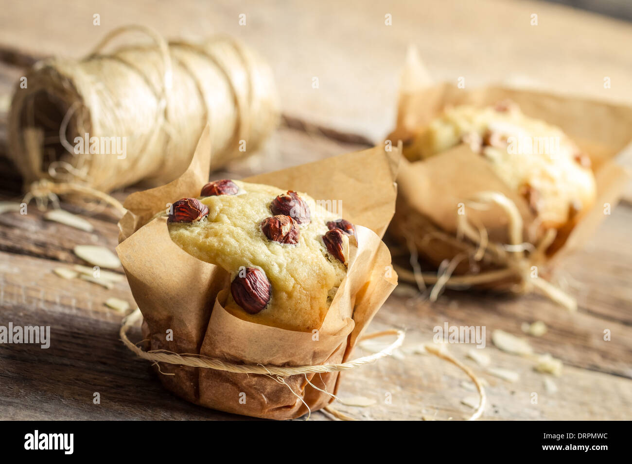 Decorating vanilla muffins with string Stock Photo - Alamy