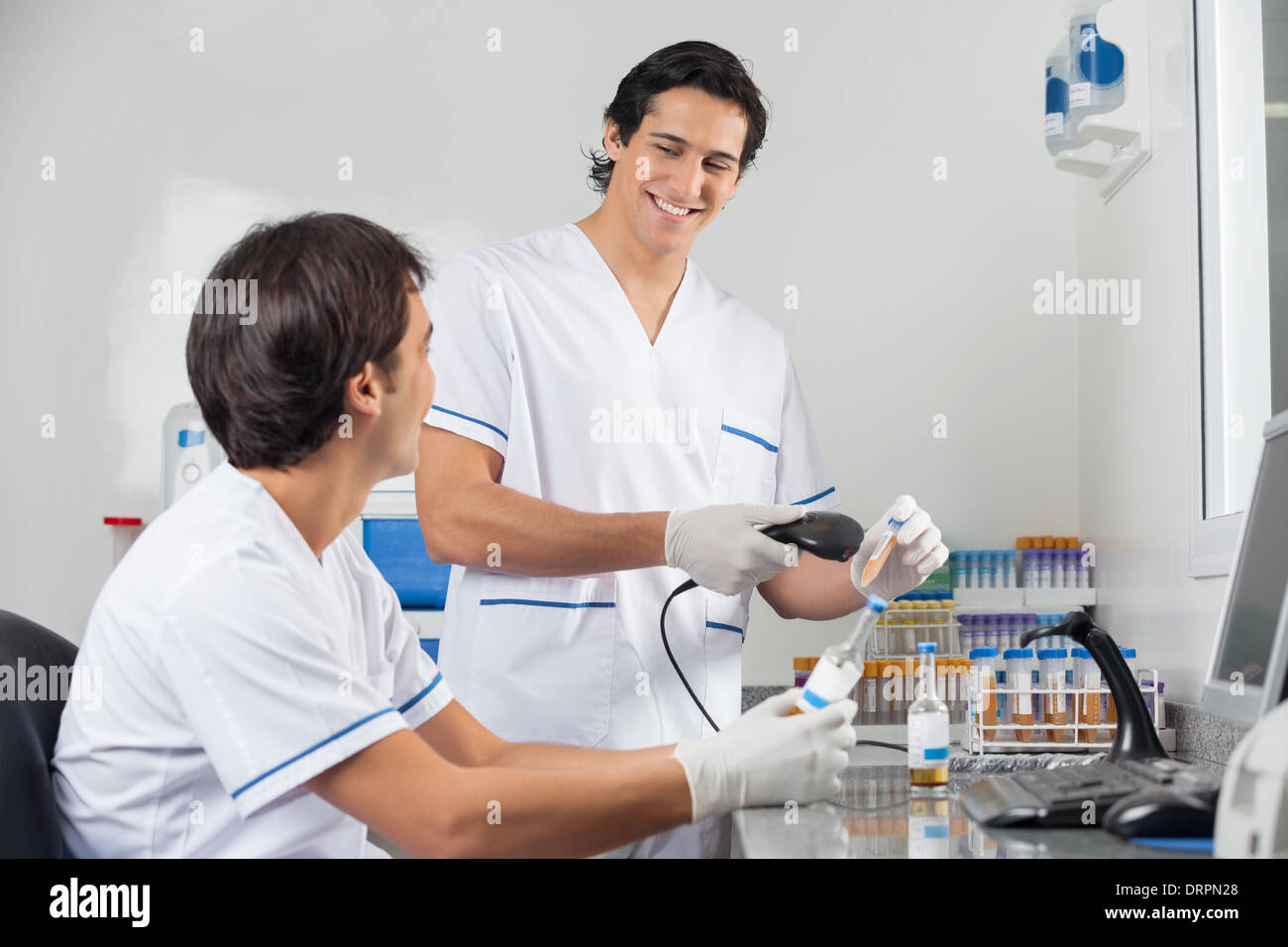 Technicians Scanning Barcode On Samples Stock Photo - Alamy