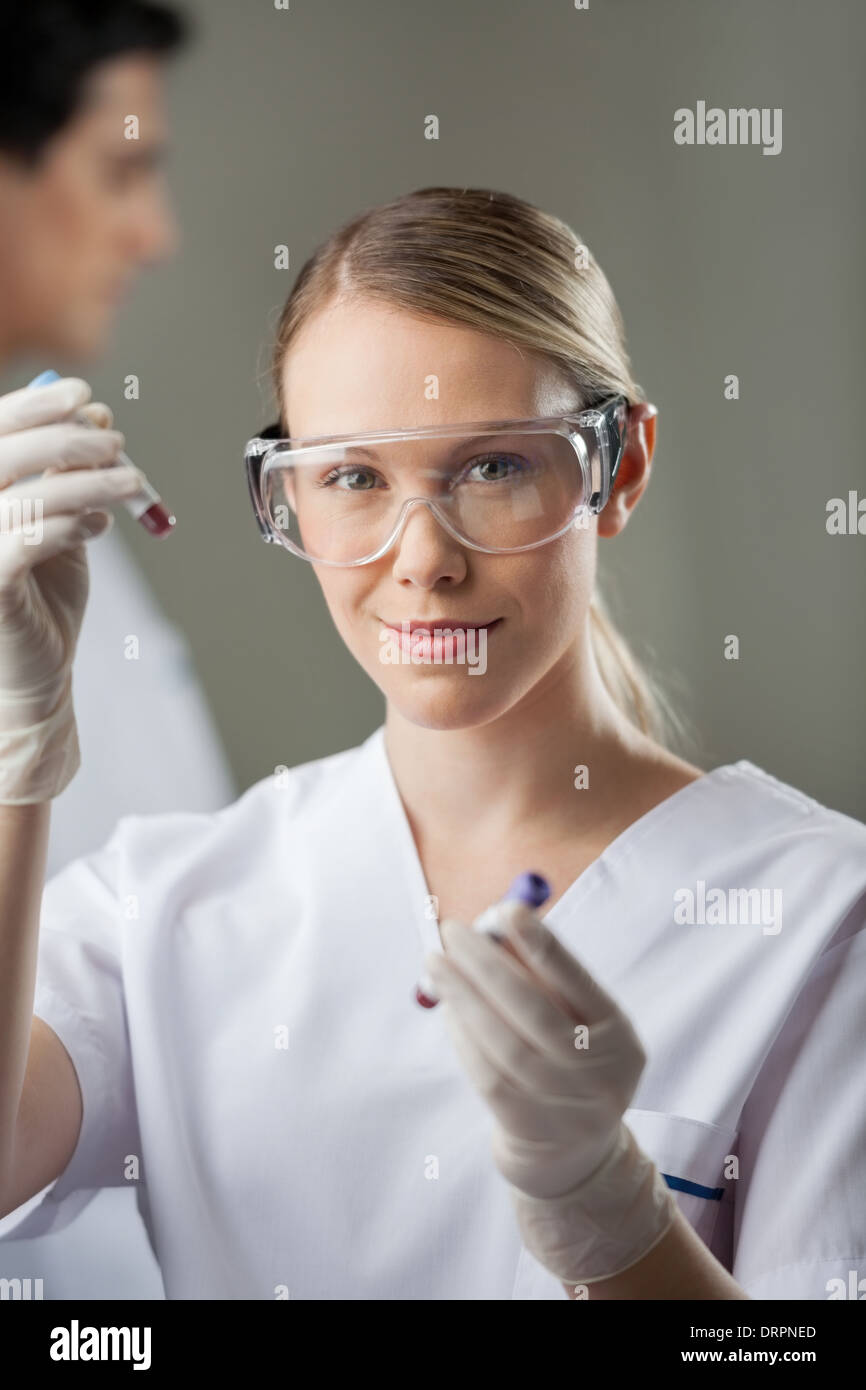 Confident Lab Technician Analyzing Blood Samples Stock Photo - Alamy