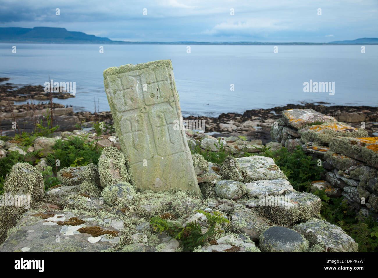 Cross-carved pillar from a sixth century monastery, Inishmurray island, County Sligo, Ireland. Stock Photo