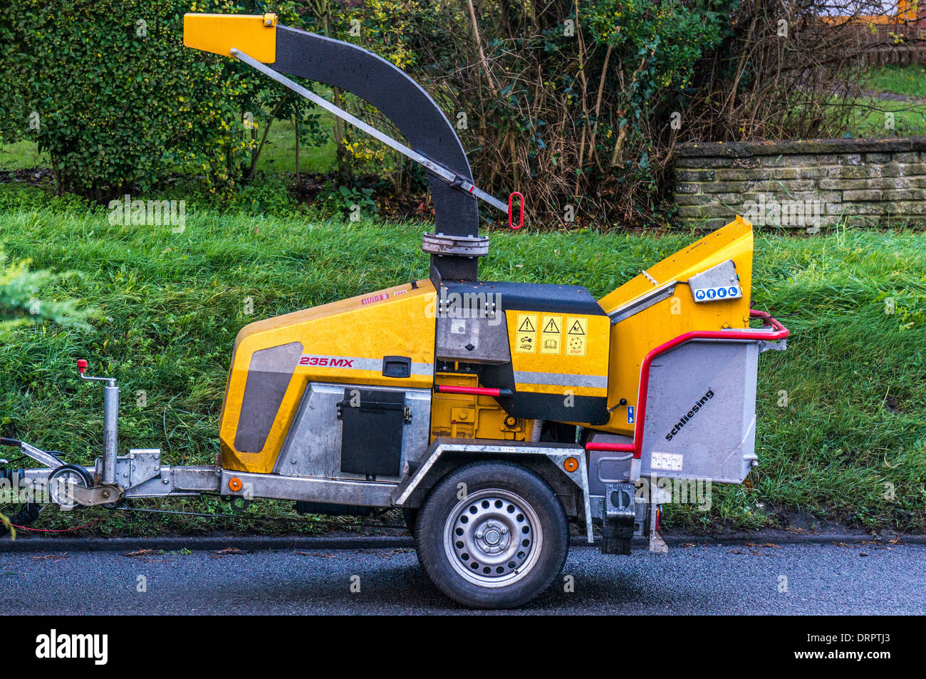 Heavy duty wood chipping machine (wood chipper) parked in the road, in
