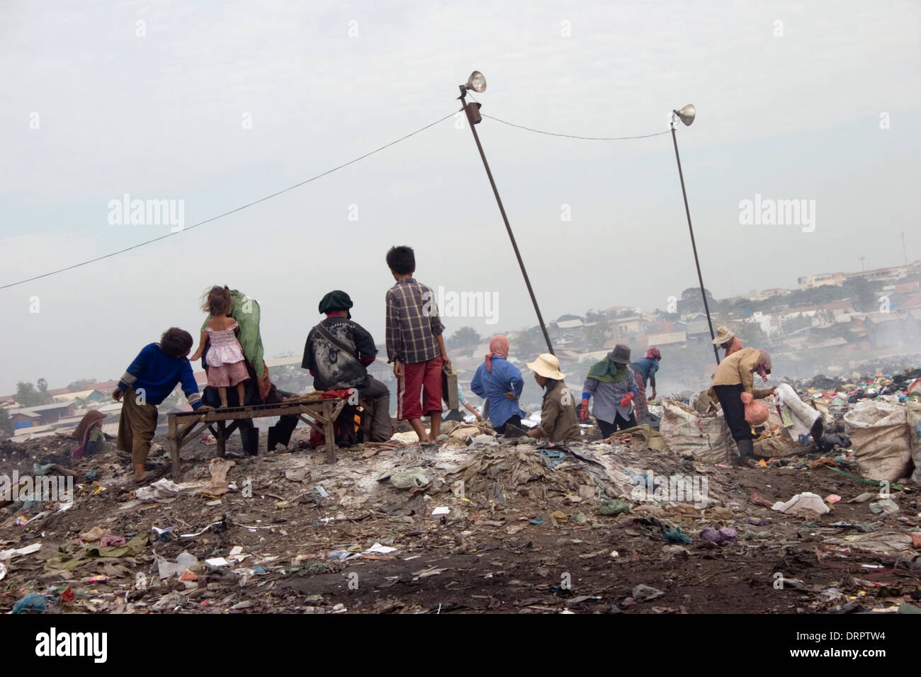 Plastic and rotting garbage provides the work environment for