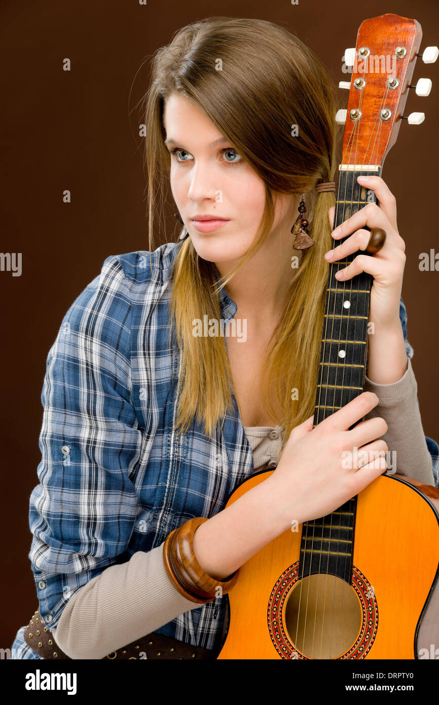 Rock musician - fashion woman holding guitar Stock Photo - Alamy